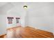 Bright bedroom with hardwood floors and two windows at 403 W 3Rd Ave, Denver, CO 80223