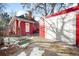 Detached garage with double doors and red brick exterior at 403 W 3Rd Ave, Denver, CO 80223