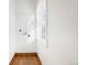Small laundry room with window and linoleum floor at 403 W 3Rd Ave, Denver, CO 80223