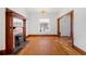 Living room featuring hardwood floors, fireplace, and open floor plan at 403 W 3Rd Ave, Denver, CO 80223