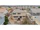 Aerial view of a home's backyard with a patio and well-maintained landscaping at 12850 Ventana St, Parker, CO 80134