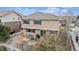 The backyard has a patio with a table and chairs, perfect for enjoying outdoor meals at 12850 Ventana St, Parker, CO 80134