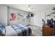 Bedroom featuring a large window, stylish bed, and a spacious closet at 12850 Ventana St, Parker, CO 80134