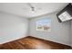 Simple bedroom with hardwood floors, natural light, and a modern ceiling fan at 12850 Ventana St, Parker, CO 80134