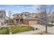 Attractive two-story home with a brick and siding exterior, complemented by manicured landscaping at 12850 Ventana St, Parker, CO 80134