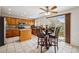 Bright kitchen featuring a dining table, central island, and stainless steel appliances at 12850 Ventana St, Parker, CO 80134