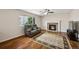 Comfortable living room with a fireplace, plush seating, and a stylish rug at 12850 Ventana St, Parker, CO 80134