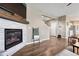 Living area with fireplace and view of kitchen and stairs at 14021 Scarlet Sage St, Parker, CO 80134