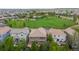 Aerial view showcasing homes with lush greenery, providing a sense of community and neighborhood charm at 14278 Greenfield Loop, Parker, CO 80134