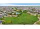 An aerial view showcases the community pool and park within the neighborhood at 14278 Greenfield Loop, Parker, CO 80134