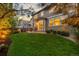 Inviting backyard featuring a lush lawn and mature trees, perfect for outdoor enjoyment and relaxation at 14278 Greenfield Loop, Parker, CO 80134