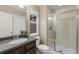 Bathroom featuring a vanity, toilet, and glass shower, offering both style and functionality at 14278 Greenfield Loop, Parker, CO 80134