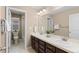 Bathroom featuring dual sinks, vanity, and a separate toilet and shower area offering style and functionality at 14278 Greenfield Loop, Parker, CO 80134