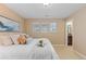 Bright bedroom with lots of natural light, plush pillows and neutral walls, offering comfort and relaxation at 14278 Greenfield Loop, Parker, CO 80134