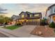 Beautiful two-story home with a well-maintained lawn, stone accents, and a two-car garage at 14278 Greenfield Loop, Parker, CO 80134