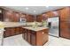 Beautiful kitchen with stainless steel appliances, custom cabinets, and a center island at 14278 Greenfield Loop, Parker, CO 80134