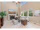 Spacious living room featuring a stone fireplace, large windows, and comfortable seating at 14278 Greenfield Loop, Parker, CO 80134