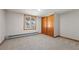 Carpeted bedroom with closet space and a window with a view at 10049 S Turkey Creek Rd, Morrison, CO 80465