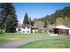 Spacious single-story home with a large yard, mature trees, and a barn at 10049 S Turkey Creek Rd, Morrison, CO 80465