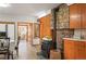 Cozy kitchen featuring a stone fireplace, wood cabinets, and a breakfast nook at 10049 S Turkey Creek Rd, Morrison, CO 80465