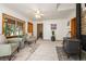 Cozy living room with fireplace, large windows, and comfortable seating at 10049 S Turkey Creek Rd, Morrison, CO 80465
