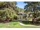 Enclosed sunroom with abundant natural light and a lovely view of the surrounding trees at 10049 S Turkey Creek Rd, Morrison, CO 80465