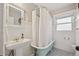 Charming bathroom with vintage clawfoot tub and bright natural light at 3210 S Washington St, Englewood, CO 80113