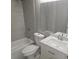 Bathroom featuring a shower-tub combo, a sink with white vanity, and decorative mirror at 4720 Thompson Ct, Denver, CO 80216