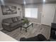 Inviting living room with stylish furniture, modern decor, and plenty of natural light at 4720 Thompson Ct, Denver, CO 80216