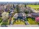 Aerial view of home showcasing lush landscaping and circular driveway at 55 Dexter St, Denver, CO 80220