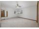 Bright bedroom with a ceiling fan and natural light, featuring neutral tones at 55 Dexter St, Denver, CO 80220