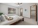 Bedroom with large window, featuring neutral tones and minimalist decor at 55 Dexter St, Denver, CO 80220