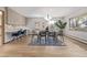 Dining area with modern light fixture, hardwood floors, and view of exterior at 55 Dexter St, Denver, CO 80220