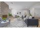Bright living room with hardwood floors, stone fireplace, and stylish furniture, perfect for relaxing or entertaining at 55 Dexter St, Denver, CO 80220