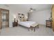 Bedroom with ensuite bath featuring a ceiling fan and modern decor at 55 Dexter St, Denver, CO 80220