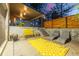 Outdoor patio area with modern furniture and a colorful rug, perfect for outdoor entertaining at 55 Dexter St, Denver, CO 80220