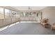Bright sun room with tiled floors and large windows that let in ample natural light at 55 Dexter St, Denver, CO 80220