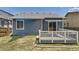 Charming backyard featuring a wood deck and a well-maintained lawn at 17692 E Brown Cir, Aurora, CO 80013