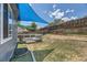 Backyard area offering a nice deck with shade sails and ample space for outdoor activities at 17692 E Brown Cir, Aurora, CO 80013