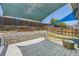Backyard with a nice deck, shade sails, and a wooden fence, perfect for entertaining at 17692 E Brown Cir, Aurora, CO 80013