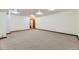 Large carpeted basement featuring bright recessed lighting and multiple electrical outlets at 17692 E Brown Cir, Aurora, CO 80013