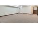 Finished basement featuring neutral carpet and stairs to main level at 17692 E Brown Cir, Aurora, CO 80013