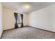 Carpeted bedroom with window and gray curtains for privacy at 17692 E Brown Cir, Aurora, CO 80013