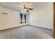A simple bedroom with neutral carpet, a ceiling fan, and one window at 17692 E Brown Cir, Aurora, CO 80013