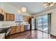 Updated kitchen with stainless steel appliances and access to a deck at 17692 E Brown Cir, Aurora, CO 80013