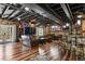 Finished basement featuring leather furniture, a bar, and hardwood floors at 7243 S Kellerman Way, Aurora, CO 80016