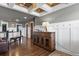 Upstairs hallway with wood flooring, custom trim work, and stylish lighting at 7243 S Kellerman Way, Aurora, CO 80016