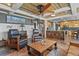 Open living room showcases slate floors, wood ceiling with ceiling fan, and seamless flow to the kitchen at 7243 S Kellerman Way, Aurora, CO 80016