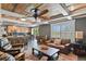 Open concept with slate floors, wood ceiling, and the kitchen can be seen from the cozy living room space at 7243 S Kellerman Way, Aurora, CO 80016