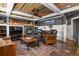 Cozy living room with fireplace, slate floors, wood ceiling, ceiling fan, and comfortable seating at 7243 S Kellerman Way, Aurora, CO 80016
